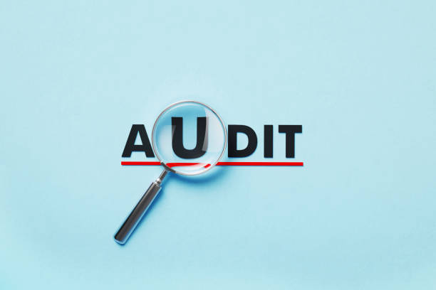 istock Magnifier Forming Audit Word On Blue Background 1398285133