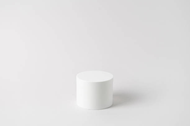 istock Empty white podium on light grey background. Minimal mockup. Round showcase for cosmetic product advertising. Abstract display or stage. Spa and beauty concept. Front view. Copy space 1398286169