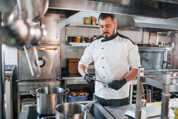 istock With professional tools. Professional chef preparing food in the kitchen 1398287342