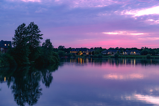 Beautiful landscape dramatic sky purple and yellow at Furzton Lake in Milton Keynes