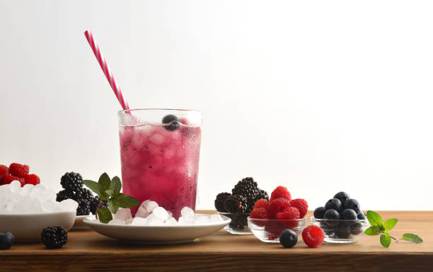 istock Beverage with berries on wooden table white isolated background 1398292153