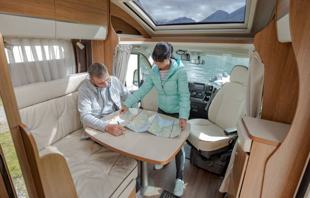 istock Couples in RV Camper looking at the local map for the trip. 1398295076