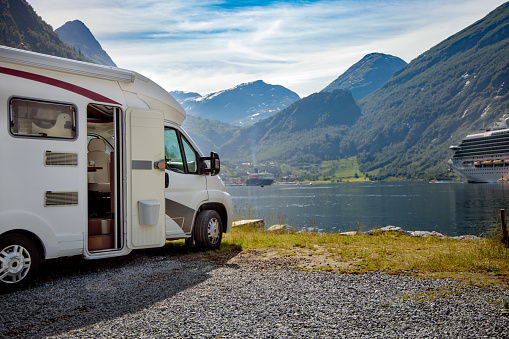 Family vacation travel RV, holiday trip in motorhome, Caravan car Vacation. Beautiful Nature Norway natural landscape.