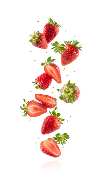 istock Whole and Sliced Fresh Strawberries in Air on White Background 1398296449