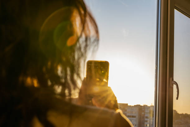 istock Unidentifiable woman taking a sunset picture 1398301287