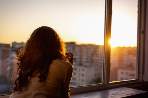 istock Woman watching the sunrise 1398301388