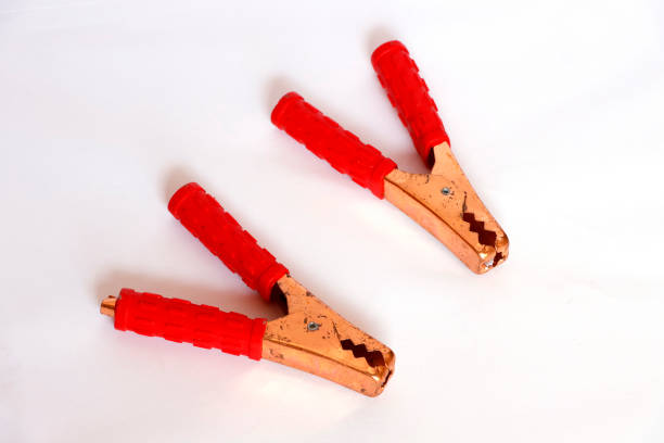 istock Car Red Jumper Clamp In White Background 1398302646