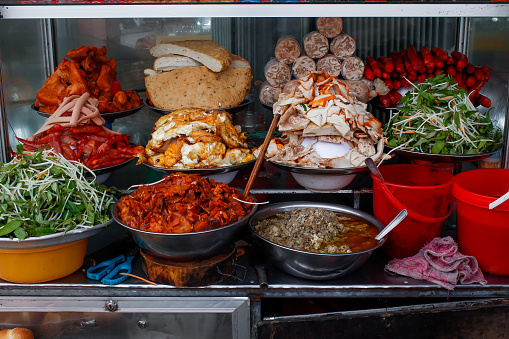 High angle view of a street food stall selling Vietnamese banh mi sandwich in Hue city, central Vietnam