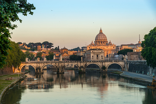 Panorama taken from the panoramic terrace of the Altare della Patria. At sunset, the golden rays of the sun illuminate the monuments of ancient Rome.