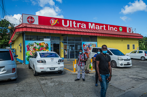 Corinth, SAINT LUCIA - May 4, 2022: Local St Lucia residents outside the supermarket in Corinth, St Lucia.