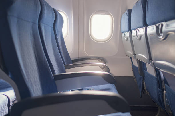 istock Empty seat on airplane while covid-19 outbreak destroy travel and airline business 1398306614