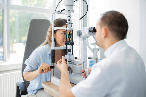 istock Beautiful young girl checking the eye vision 1398310561