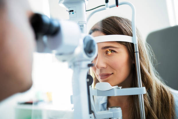 Checking the eye vision Beautiful young girl checking the eye vision in modern ophthalmology clinic optometry stock pictures, royalty-free photos & images