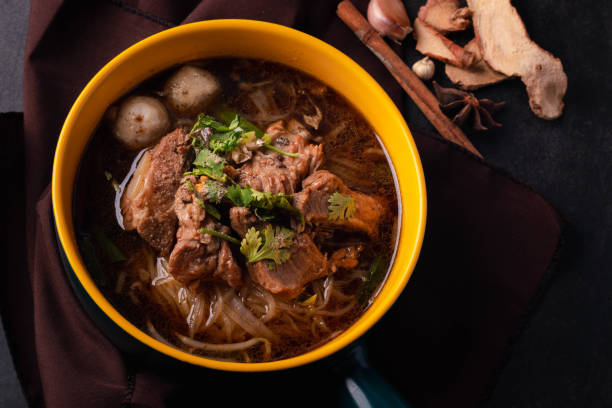istock Braised pork noodles in a ceramic cup, black tone picture 1398310874