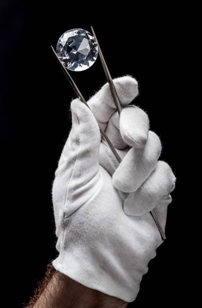 istock Large gemstone in jeweler's hand close up. Gem identifying and evaluating process. 1398310892