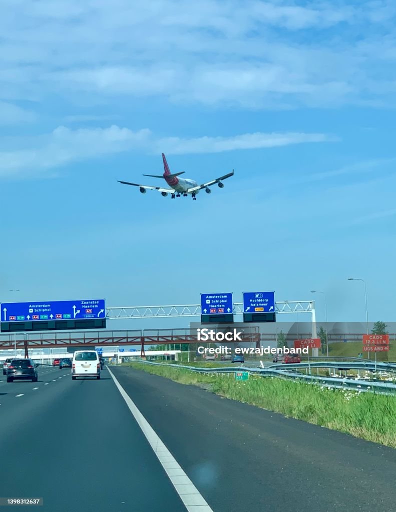 Airplane and traffic Traffic and airplane in Schiphol Amsterdam Amsterdam Schiphol Airport Stock Photo