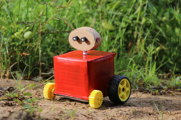 Four wheeled robot with a head and eyes which was a part of a science exhibition placed outdoors