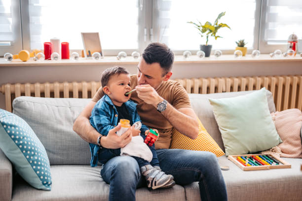 istock Father Feeding His Child 1398316128