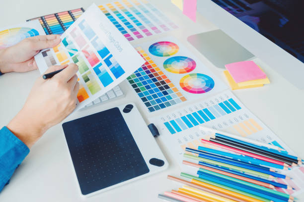 istock Two Graphic designer Brainstorming Meeting and drawing on graphics tablet at workplace 1398317473