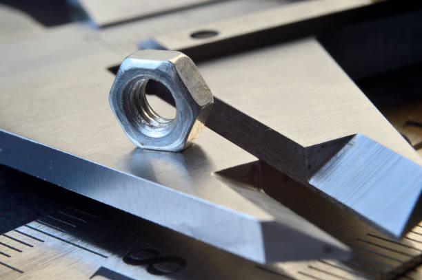 istock Accurate measuring tool caliper and metal ruler lie in place with nuts. close-up 1398320683