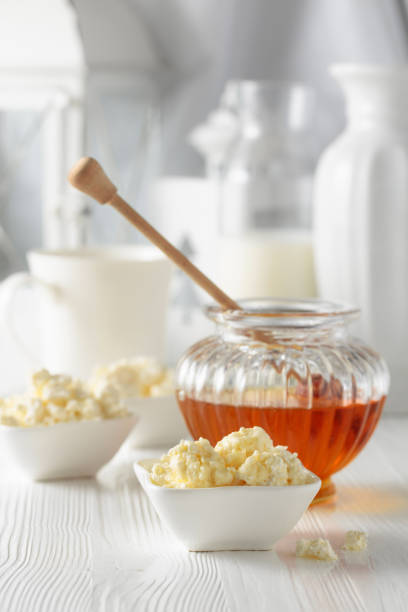 istock Fresh homemade cottage cheese with honey. 1398323123