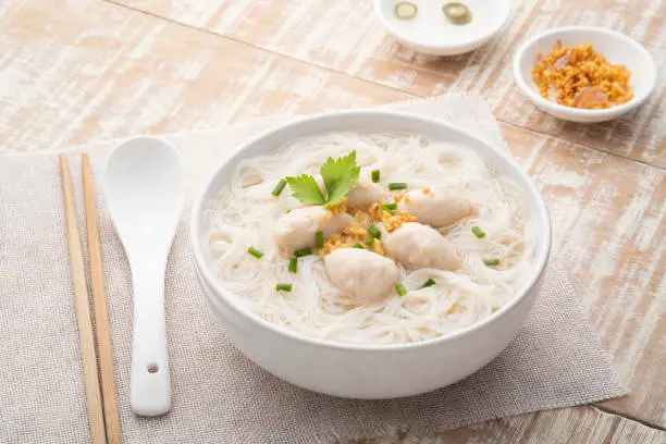 Rice vermicelli Noodle soup with pork balls in white bowl