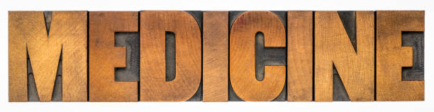 istock medicine word abstract in wood type 1398328411