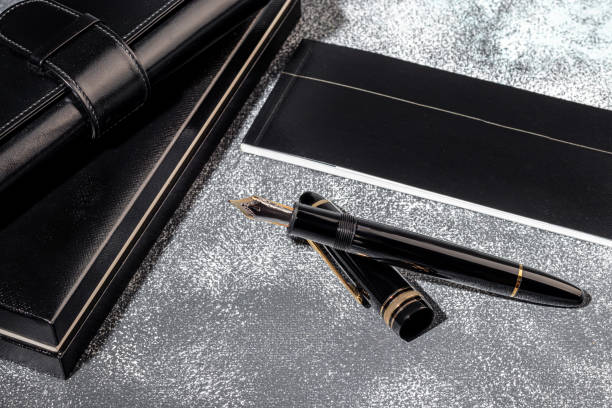 istock Fountain pen on a marble and gray background. Selective focus. 1398329962
