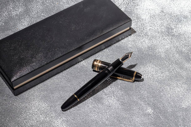 istock Fountain pen on a marble and gray background. Selective focus. 1398329980