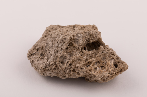 Pumice Igneous volcanic rock geological specimen. A product of high gas content in volcanic eruptions causing a crystaline rock with many cavities and low density
