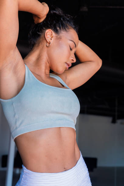 istock Afro woman is in her exercise room doing yoga 1398331172