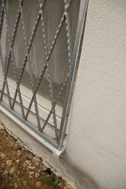 istock Grille in front of a window is only provisionally fixed 1398331861