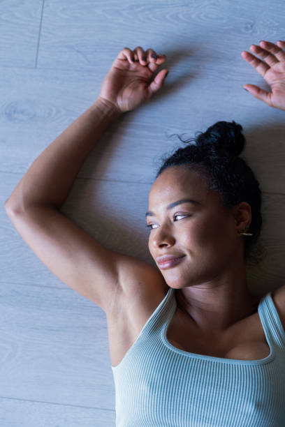 istock Afro woman is in her exercise room doing yoga 1398331881