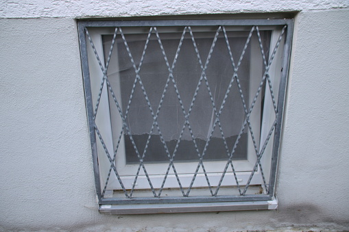 Grille in front of a window is only provisionally fastened