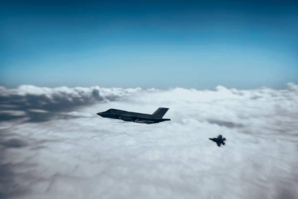 istock Jet fighters flying over the clouds. 1398332445