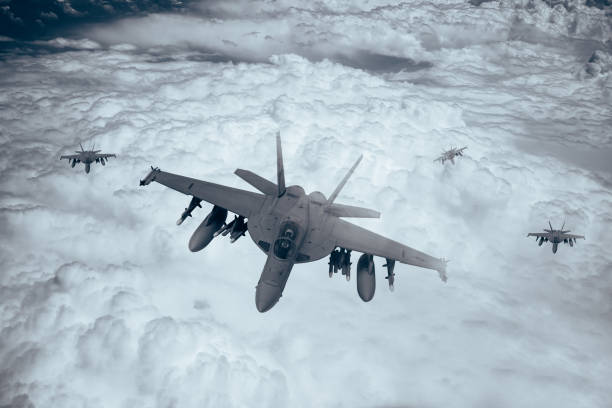 istock Jet fighters flying over the clouds. 1398332548
