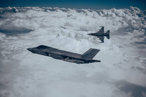 istock Jet fighters flying over the clouds. 1398333170