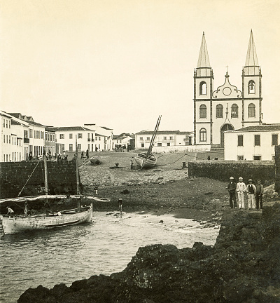 Port and church, Igreja de Santa María, on town square in Madalena (Magdalena), Pico Island, Azores, Portugal. By M. Goulart 1897.
