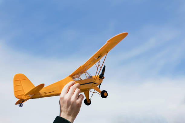 istock Yellow plane above the sky 1398340483