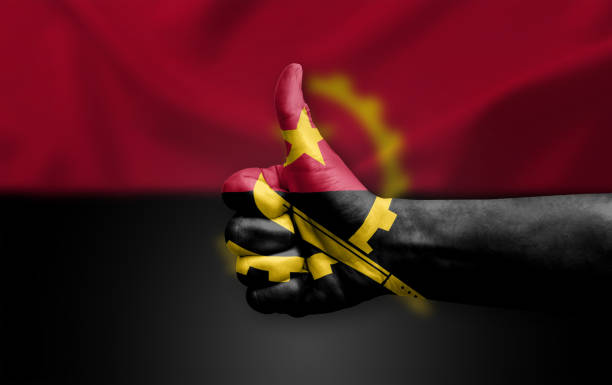 Hand making thumb up painted with flag of angola