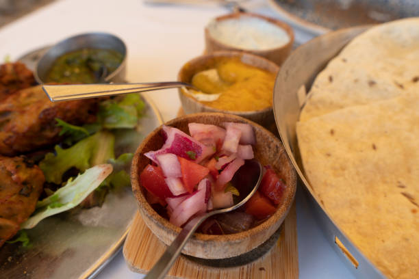 istock Indian poppadoms with pickle and chutney tray. 1398345377