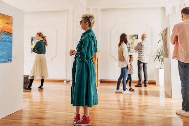 People in art gallery stock photo