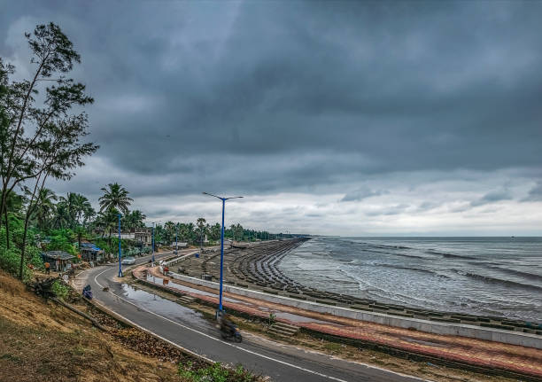 Cloudy day during a cyclonic storm at the coast of West Bengal at Digha Sea Beach on 12December 2021 when Jawad storm made a landfall. Cloudy day during a cyclonic storm at the coast of West Bengal at Digha Sea Beach on 12December 2021 when Jawad storm made a landfall. bay of bengal stock pictures, royalty-free photos & images