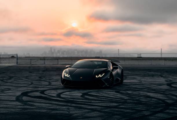 Russia, Moscow, September,30 2020. An orange Lamborghini supercar stands at the Bank at night.