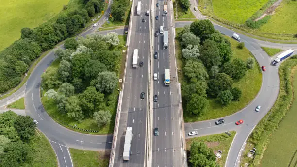 Wide angle aerial view of the M6 Motorway running through Staffordshire, England, UK.