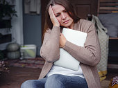 Stressed forgetful middle aged woman at home