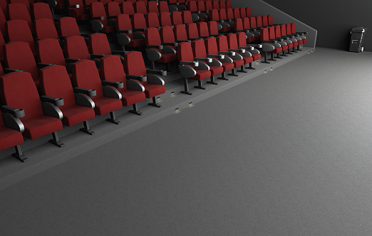 3D illustration of rows of red armchairs placed near gray floor in spacious hall of modern cinema