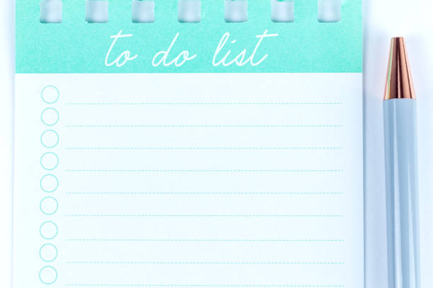 To do list empty closeup with a pen in pastel colours. Paper notebook sheet with a bucket list.