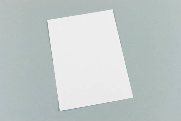 istock Mockup of white blank empty page for invitation, documents, card, branding on grey background 1398350725