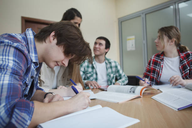istock Group of students at classroom together 1398352996